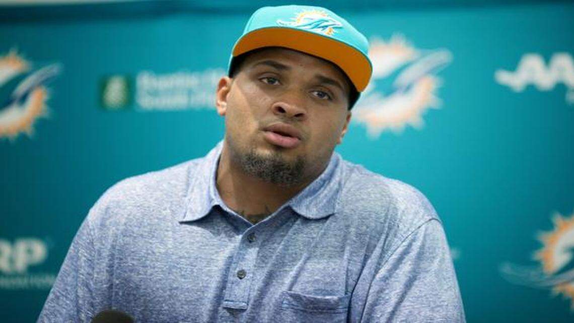 
Mike Pouncey talks to the media after the Miami Dolphins signed him to a contract extension through the 2020 season Monday, April 13, 2015 press conference in Davie, Fla. 
