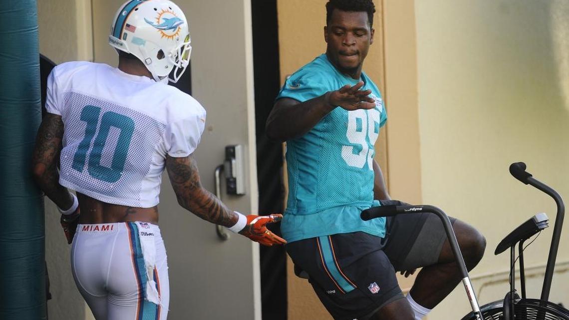 Miami Dolphins defensive end Dion Jordan, right, will not be eligible to play until the seventh week of the season.