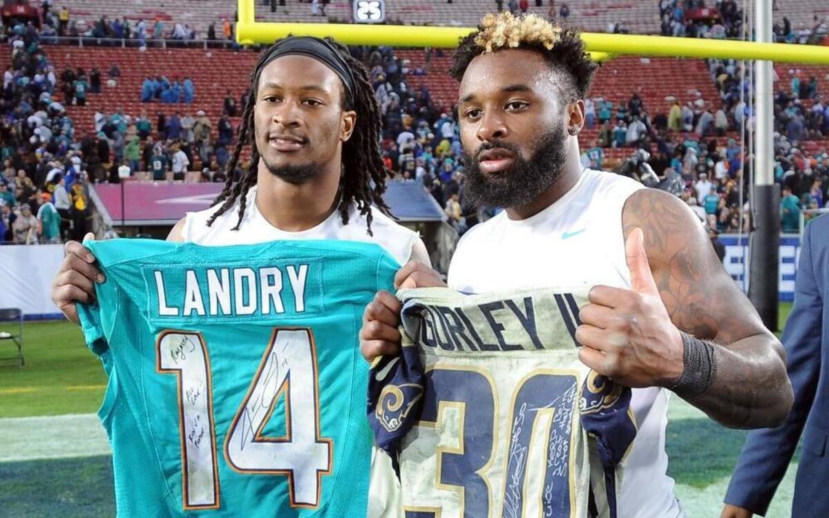 Dolphins receiver Jarvis Landry, right, exchanges jerseys with Rams running back Todd Gurley on Sunday.