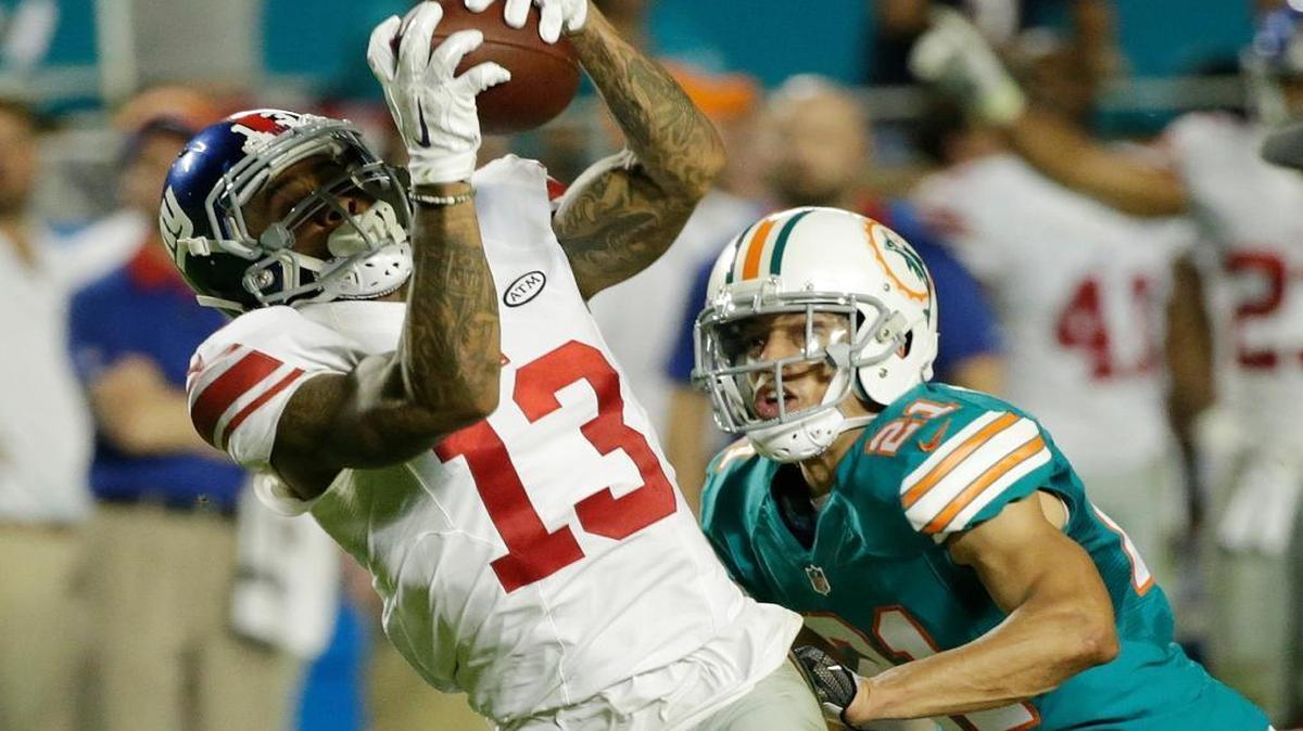 Brent Grimes, right, was released Wednesday after three years in Miami.