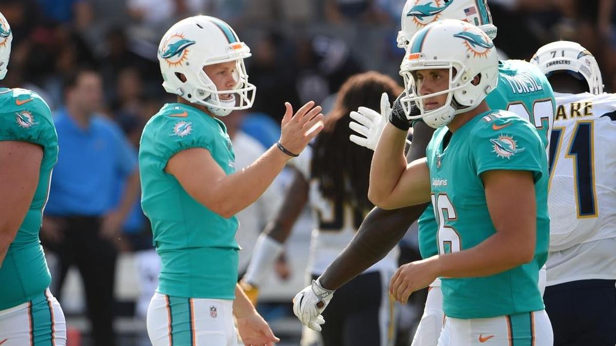 Miami Dolphins kicker Cody Parkey, right, celebrates after kicking a field goal during the second half of an NFL football game against the Los Angeles Chargers on Sunday in Carson, California.