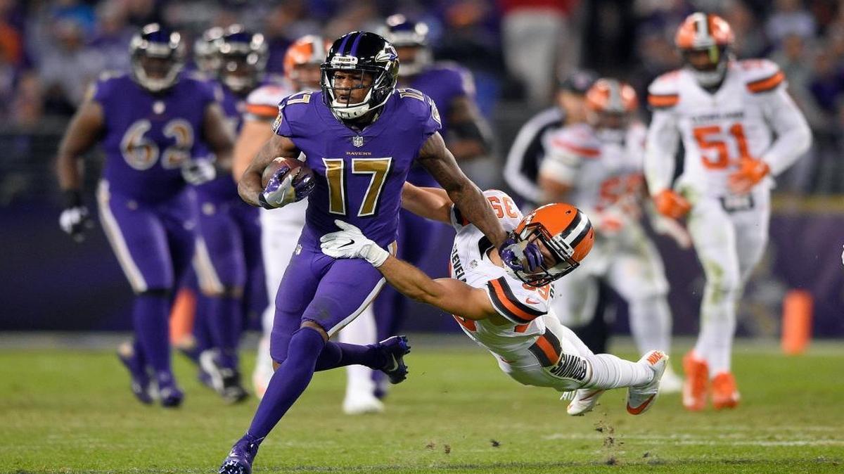 Baltimore Ravens wide receiver Mike Wallace (17) tries to break free from Cleveland Browns defensive back Ed Reynolds II on a carry during the second half an NFL football game, Thurs., Nov. 10, 2016, in Baltimore.