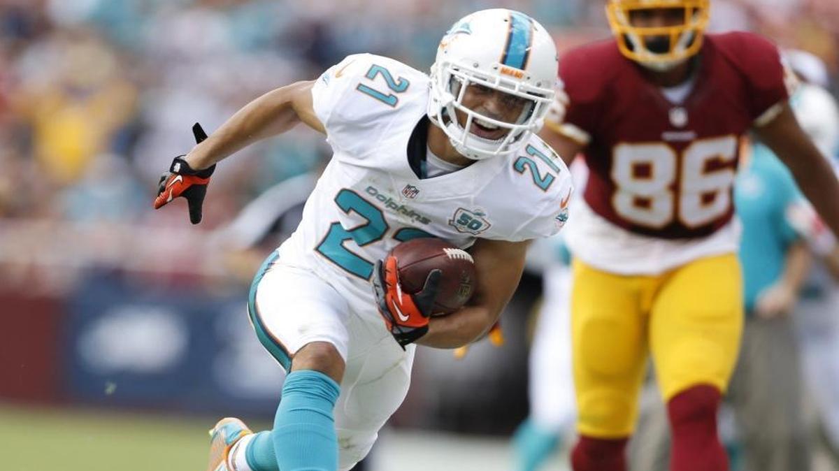 Miami Dolphins cornerback Brent Grimes (21) intercepts a pass against the Washington Redskins at FedExField in Landover, Maryland on Sunday, September 13, 2015.