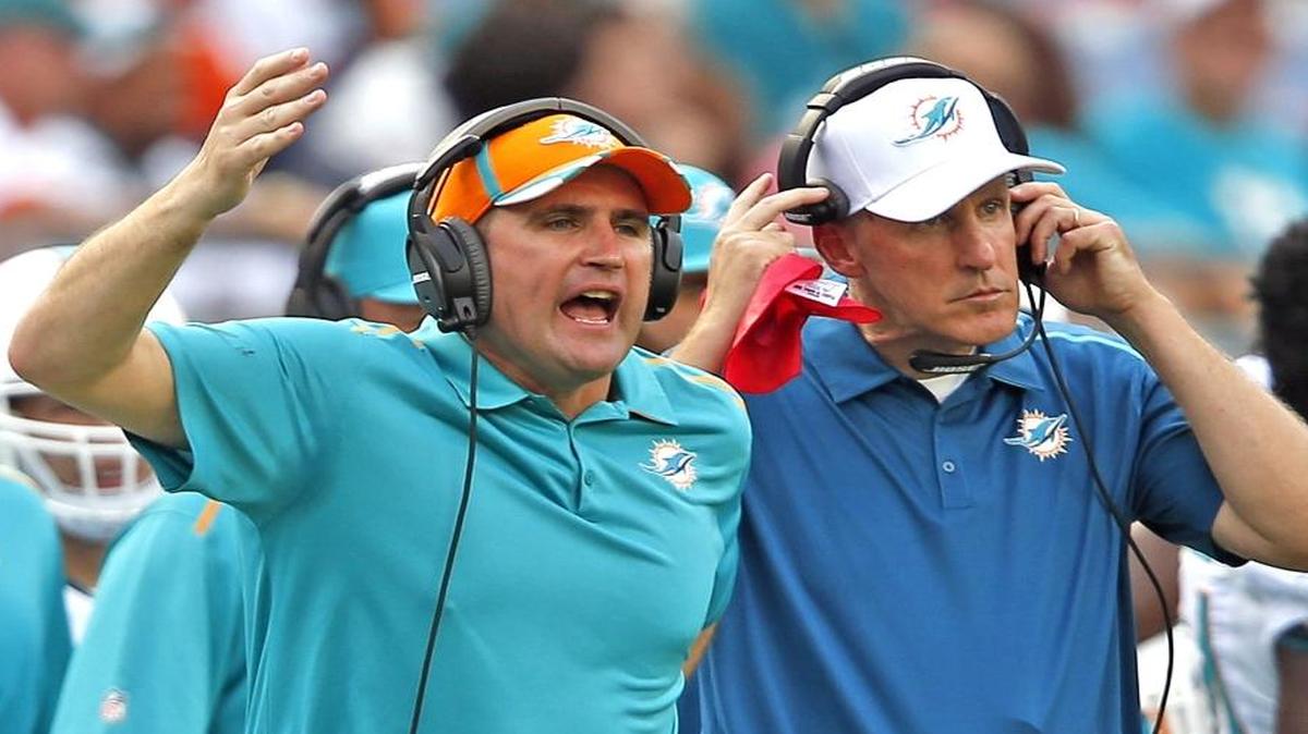 Miami Dolphins assistant coach Darren Rizzi, left, with former head coach Joe Philbin at Sun Life Stadium in 2014.