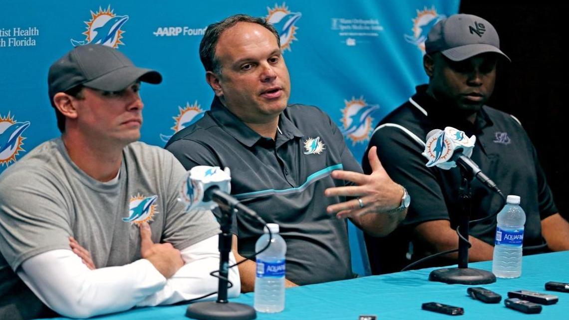 From left, Miami Dolphins coach Adam Gase, vice president of football operations Mike Tannenbaum and general manager Chris Grier talk to the media at a season-ending news conference at the team’s practice facility in Davie.