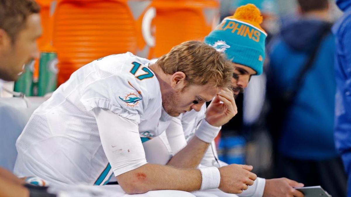 Miami Dolphins quarterback Ryan Tannehill (17) on the bench late in the fourth quarter as the New York Jets defeat the Miami Dolphins 38-20 at Met Life Stadium in East Rutherford, N.J. on Sunday, November 29, 2015.