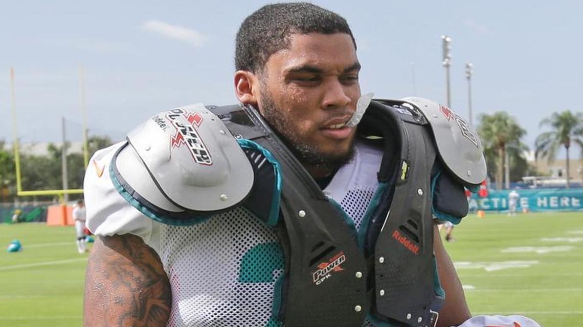 
Miami Dolphins offensive guard Jamil Douglas walks off the field after practice at training camp Wednesday, Aug. 5, 2015 in Davie, Fla. 
