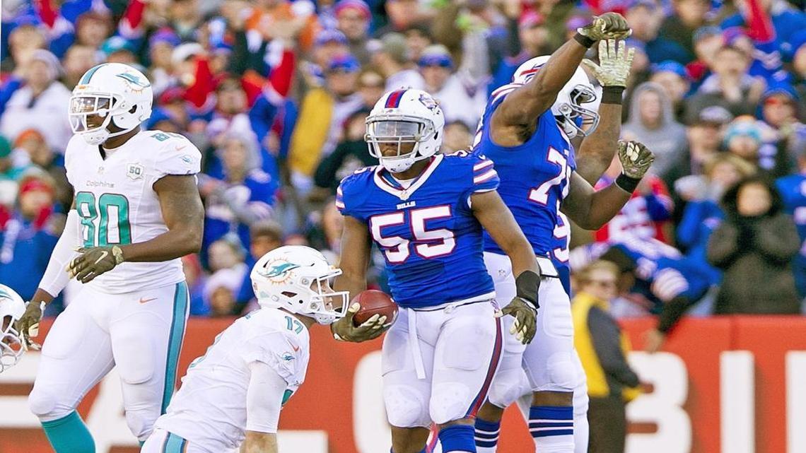 Miami Dolphins quarterback Ryan Tannehill (17) is sacked and fumbles the ball as Buffalo Bills defensive end Jerry Hughes (55) recovers in the third quarter. Buffalo Bills host the Miami Dolphins at Ralph Wilson Stadium, Orchard Park, N.Y. on Sunday, November 8, 2015.