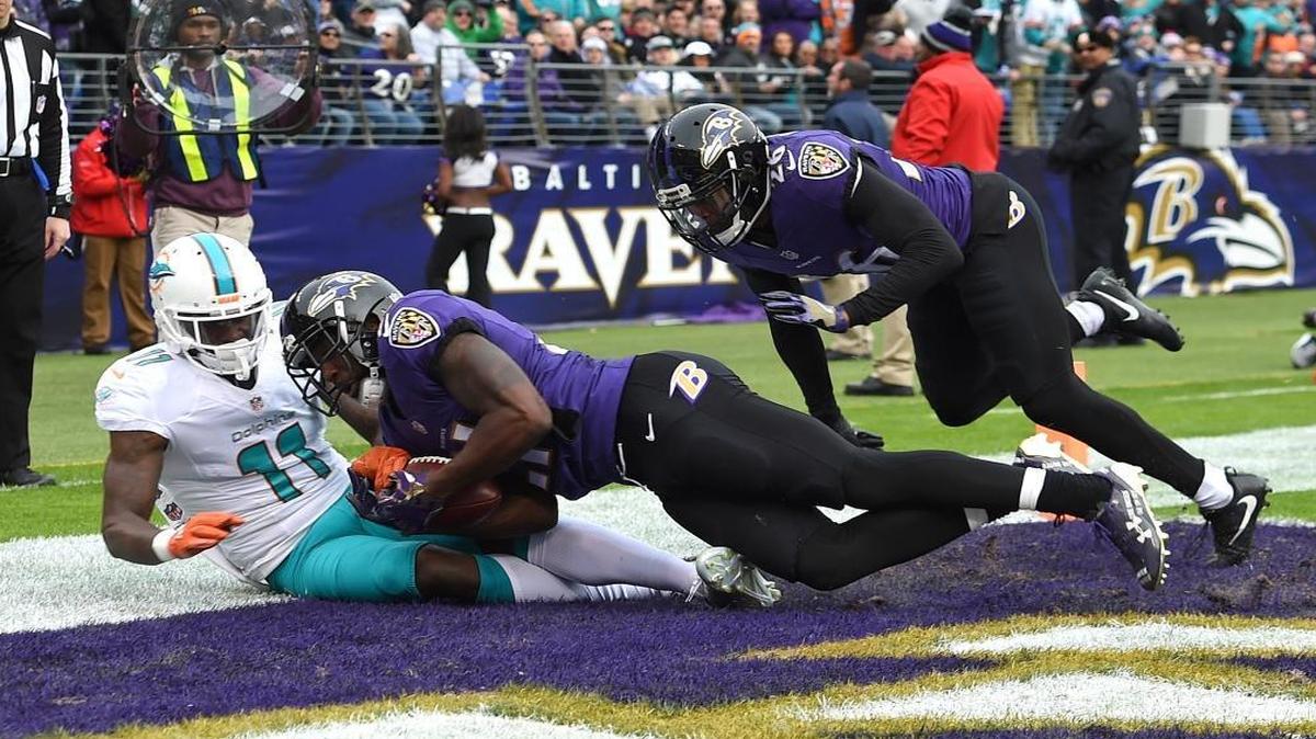 Lardarius Webb came down with the ball. DeVante Parker did not.