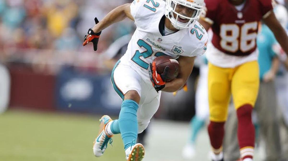 
Miami Dolphins cornerback Brent Grimes (21) intercepts in the second quarter. The Washington Redskins host the Miami Dolphins at FedExField in Landover, Maryland on Sunday, September 13, 2015.
