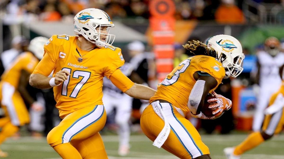 Good news for your retinas: These all-orange Dolphins jerseys are going in mothballs.