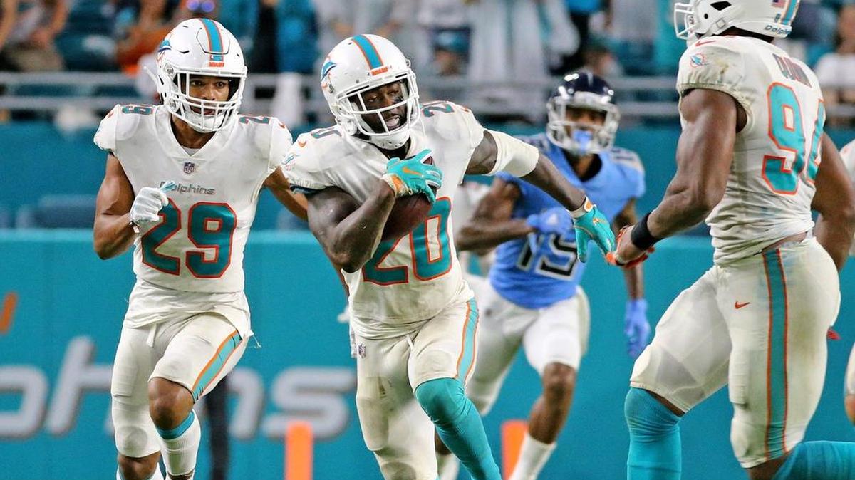 Dolphins safety Reshad Jones returpns an interception vs. Tennessee at Hard Rock Stadium on Sept. 9, 2018.