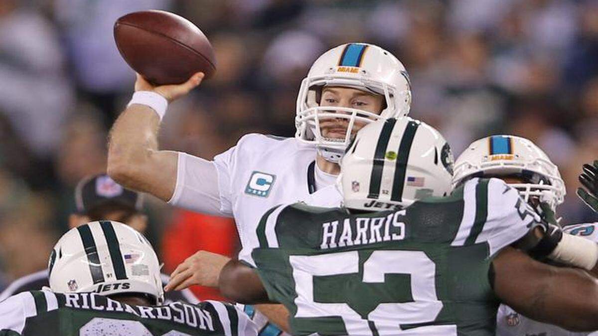 
Dolphins quarterback Ryan Tannehill looks for an open receiver during Monday night’s game against the Jets. Tannehill finished 25 of 35 for 235 yards and one interception, but it was enough for Miami to squeak out a win.
