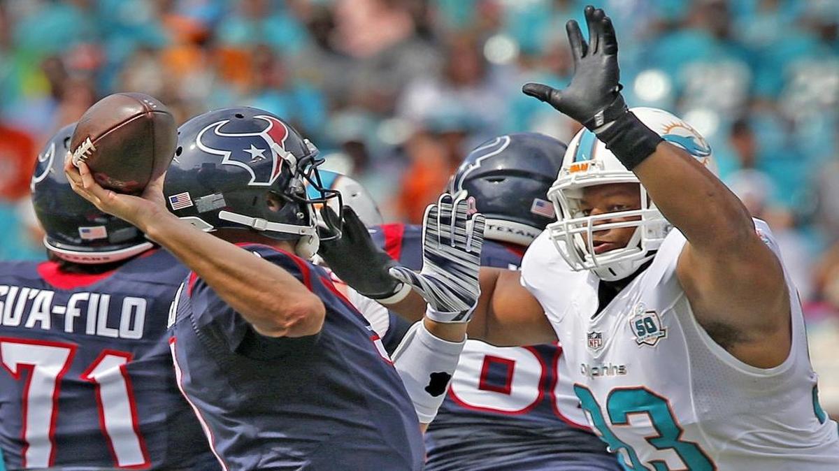 Miami Dolphins Ndamukong Suh charges Houston Texans quarterback Brian Hoyer in the first quarter at Sun Life Stadium in Miami Gardens, Florida, October 25, 2015.