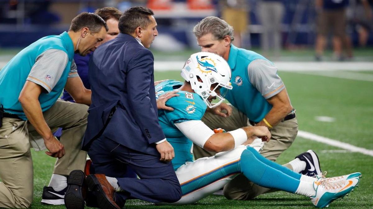 Miami Dolphins quarterback Matt Moore (8) is helped by staff after suffering an unknown injury in the first half of an NFL preseason football game against the Dallas Cowboys, Fri., Aug. 19, 2016, in Arlington, Texas.