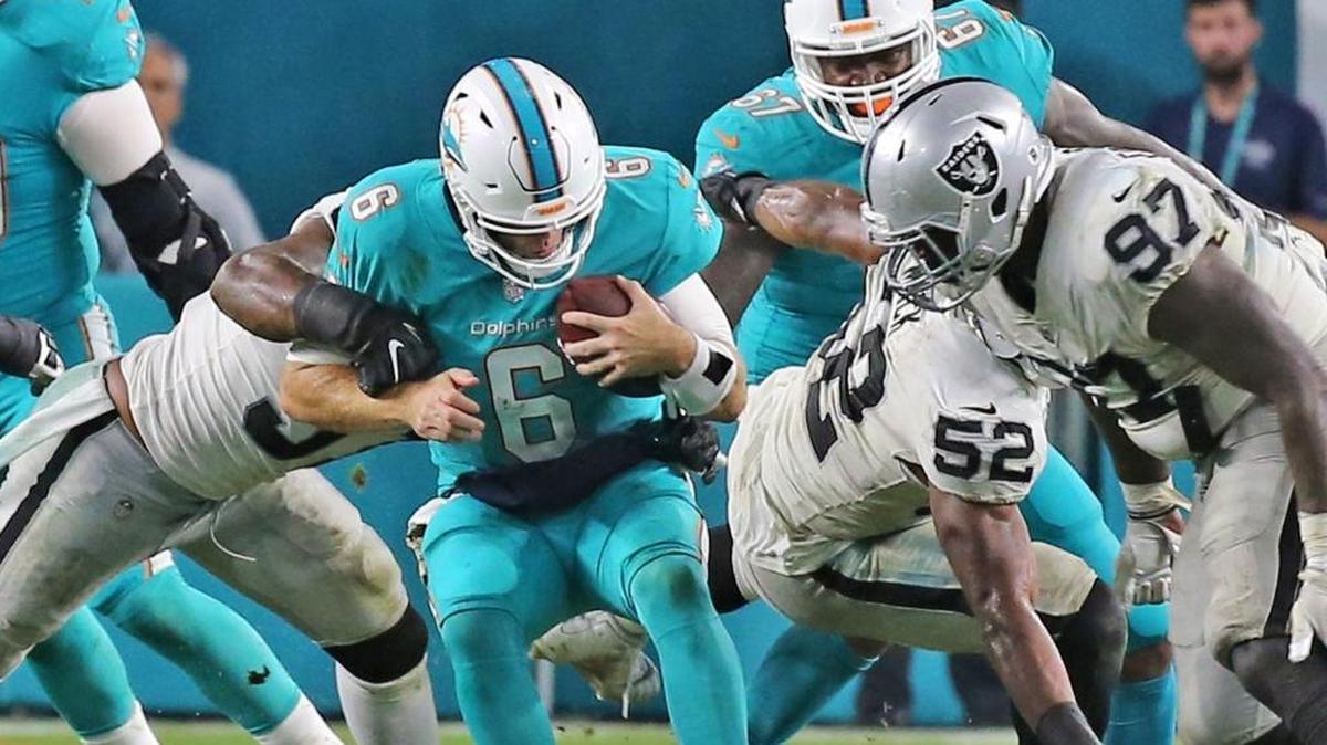 Miami Dolphins quarterback Jay Cutler (6) is sacked in their defeat to the Oakland Raiders at Hard Rock Stadium in Miami Gardens, Florida, Nov. 5, 2017.