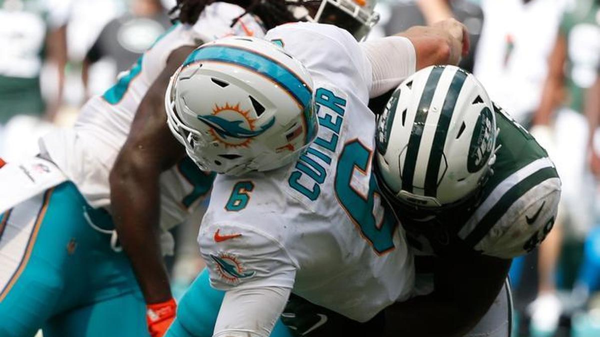 New York Jets outside linebacker Jordan Jenkins (48) grabs Miami Dolphins quarterback Jay Cutler (6) and slams him to the ground, during the second half of an NFL football game, Sunday, Oct. 22, 2017, in Miami Gardens, Fla. Cutler was injured on the play.
