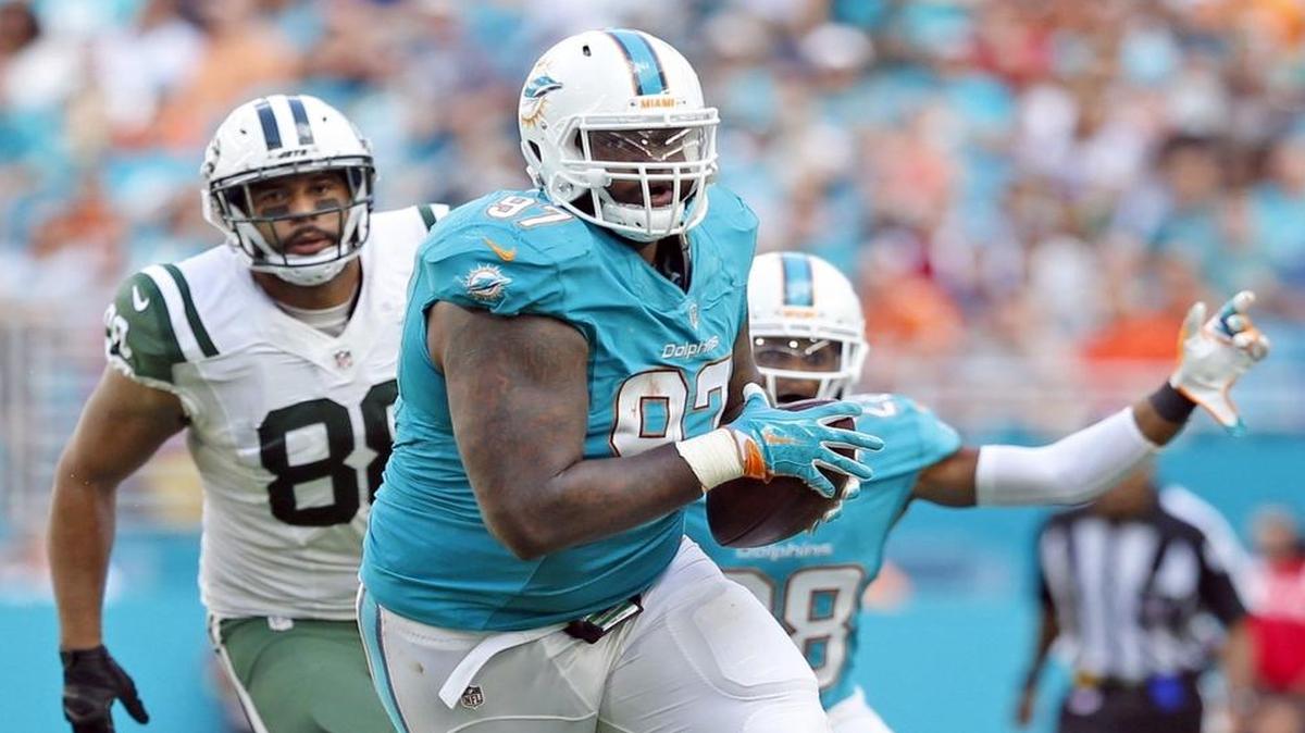 Miami Dolphins defensive tackle Jordan Phillips (97) intercepts the ball in the third quarter as the Miami Dolphins host the New York Jets at Hard Rock Stadium on Sunday, November 6, 2016.