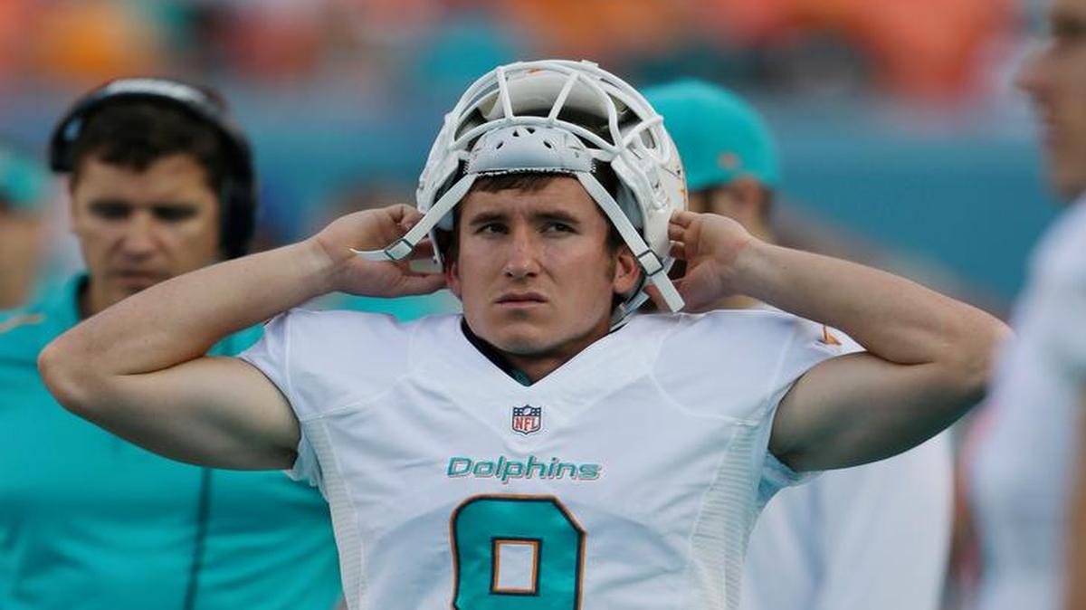 
Miami Dolphins kicker Caleb Sturgis (9) walks along the sideline during the second half of an NFL football game against the Baltimore Ravens, Sunday, Dec. 7, 2014 in Miami Gardens, Fla. The Ravens defeated the Dolphins 28-13. 
