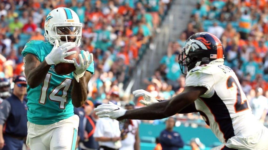 Miami Dolphins Jarvis Landry (14) catches a pass against Denver in a game on Dec. 3.