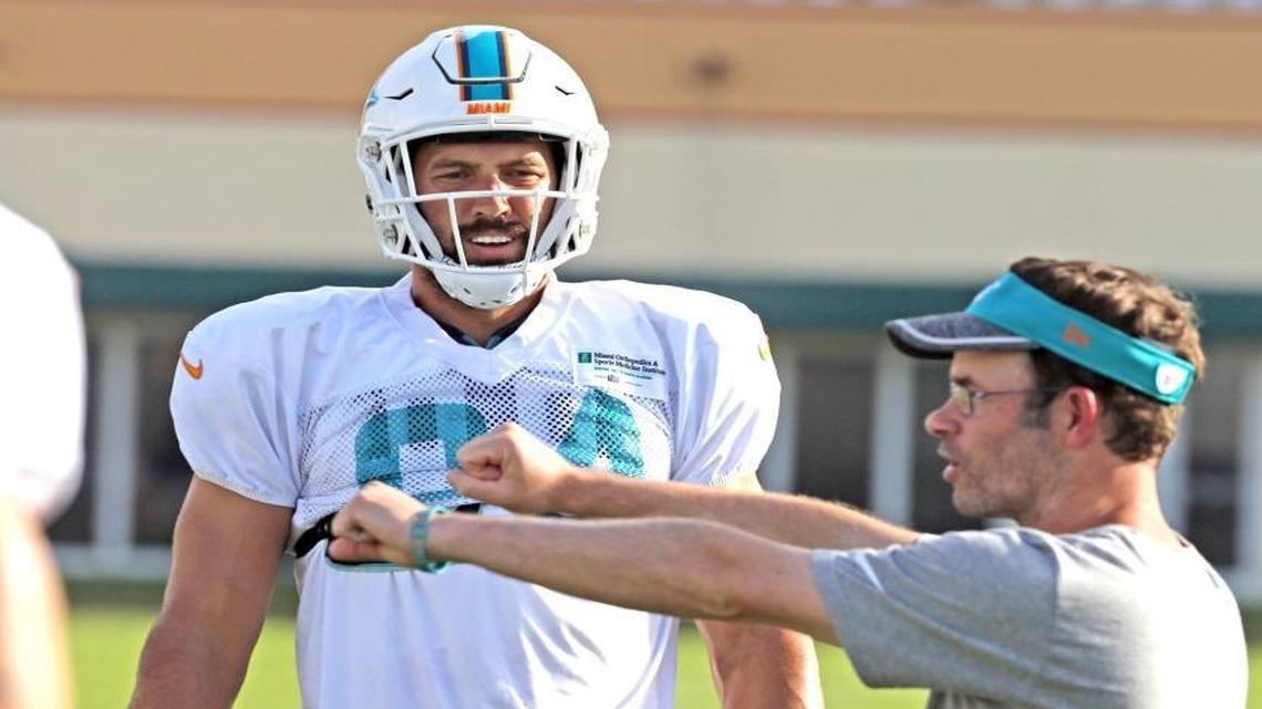 Tight ends coach Shane Day works with Jordan Cameron at the Miami Dolphins training facility in Davie, Florida on Mon., Aug. 15, 2016.