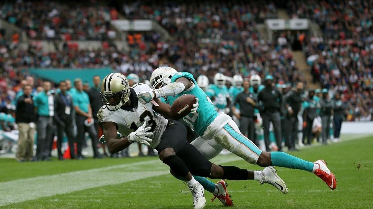 New Orleans Saints wide receiver Michael Thomas, left, scores a touchdown against Miami Dolphins cornerback Cordrea Tankersley during the second half of Sunday’s game at Wembley Stadium in London.