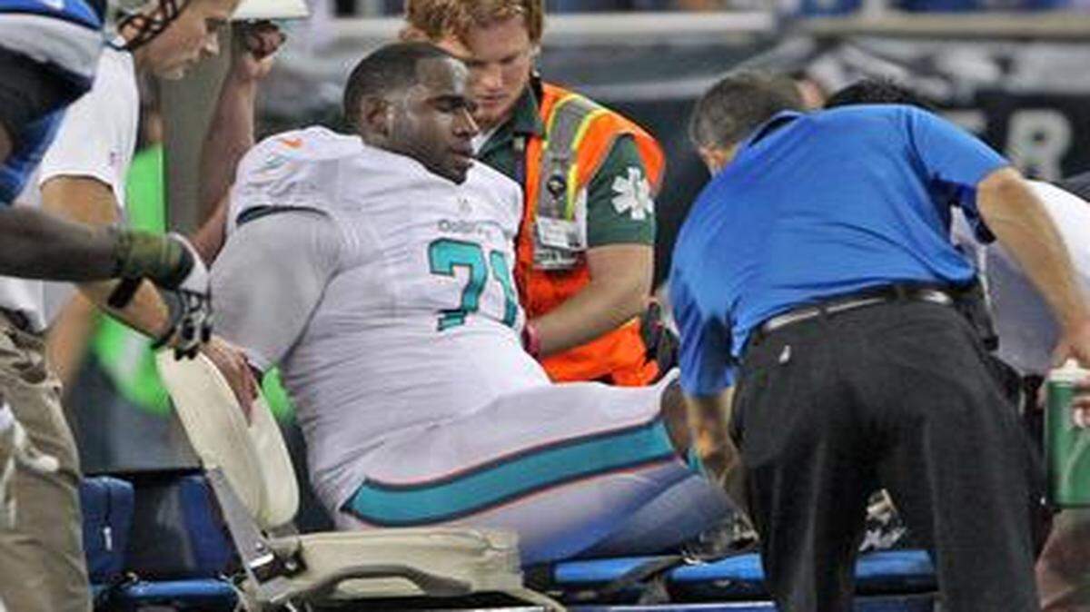 
Miami Dolphins left tackle Branden Albert is carted off the field after a knee injury against the host Detroit Lions on Nov. 9, 2014.
