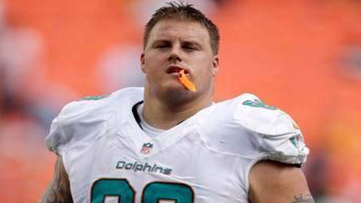 
In this Oct. 20, 2013, file photo, Miami Dolphins guard Richie Incognito walks on the sideline during a game against the Buffalo Bills in Miami Gardens, Fla. 
