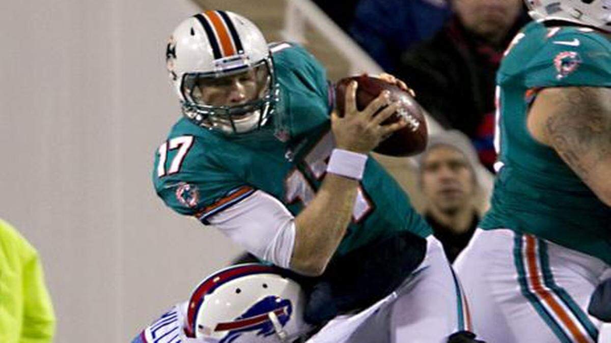 
Wrapped up: Dolphins quarterback Ryan Tannehill is sacked by the Bills’ Mario Williams in 2012. 
