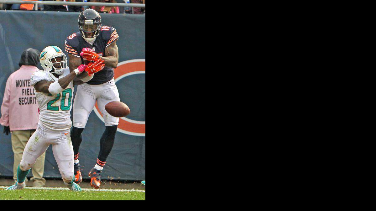 
Miami Dolphins safety Reshard Jones breaks up a pass to Chicago Bears receiver Brandon Marshall in the final seconds of the fourth quarter at Soldier Field in Chicago, Illinois, on Sunday, Oct. 19, 2014.

