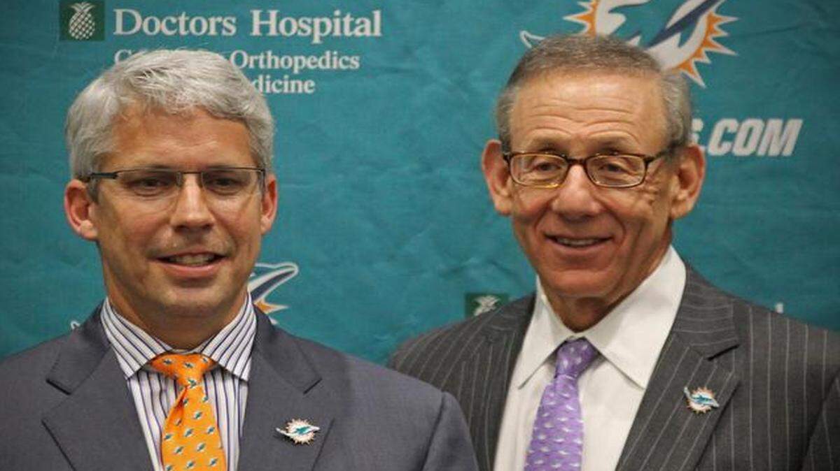 
Miami Dolphins owner Stephen Ross, right, names Dennis Hickey the general manager at Dolphins Training Facility on Tuesday, Jan. 28, 2014.

