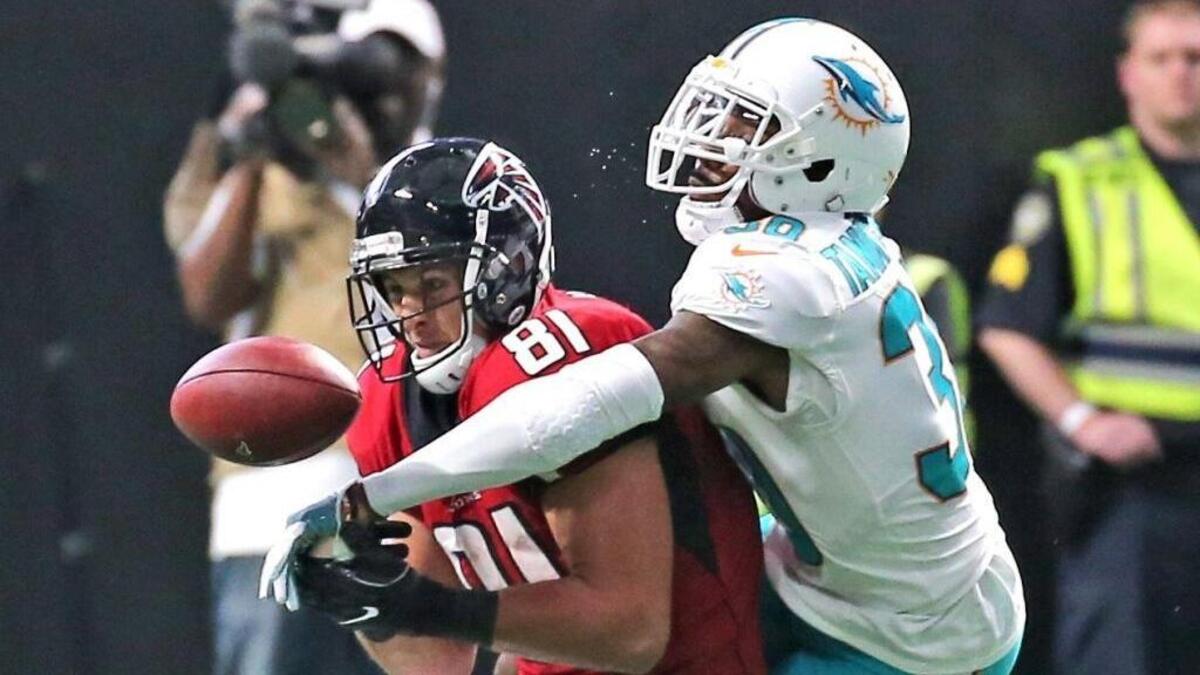 Cornerback Cordrea Tankersley  (30) deflects the ball from Atlanta Falcons’ Austin Hooper (81), which resulted in a Reshad Jones interception, to seal a win against Atlanta last October. Tankersley is battling to remain a starter.