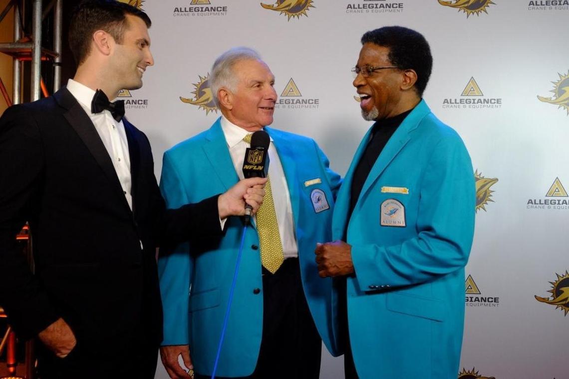 From left, Jeff Darlington interviews Nick Buoniconti and Mercury Morris during a red carpet event at the Dolphins gala for the 50th Season All Time Team.