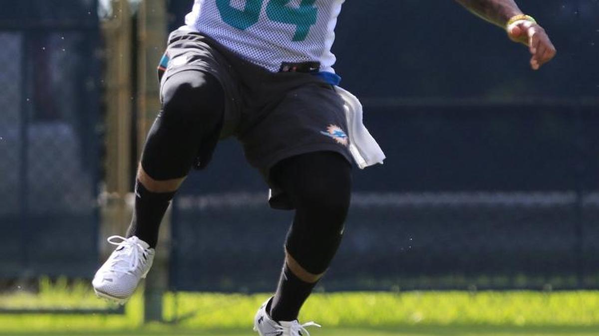 Miami running back Arian Foster runs drills on the opening day of training camp last month.