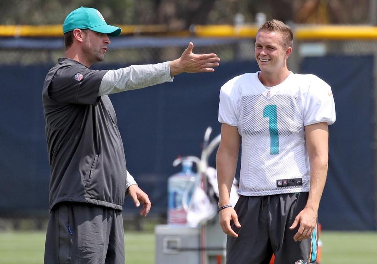 Head coach Adam Gase speaks to kicker Cody Parkey (1) during Miami Dolphins football practice on Wed., Sept. 20, 2017.