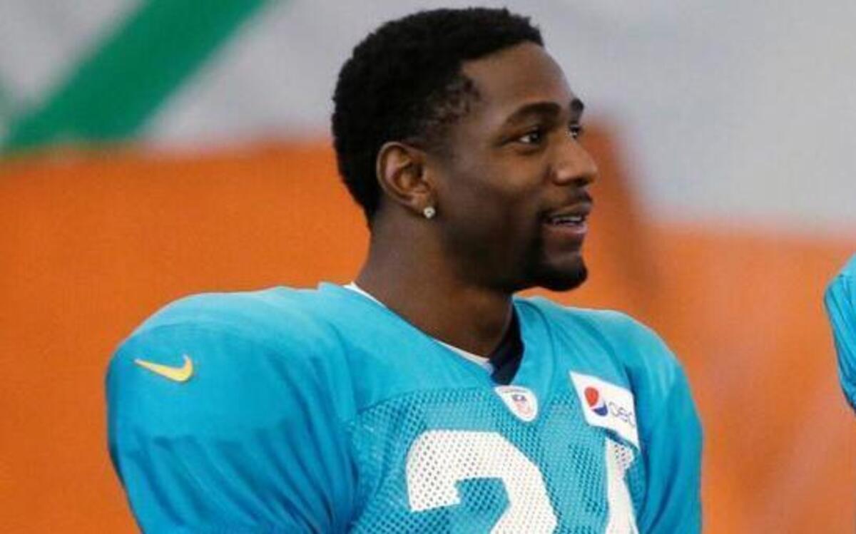 
Miami Dolphins cornerback Brice McCain, left, and safety Will Davis chat during training camp Wednesday, Aug. 5, 2015 in Davie, Fla. 
