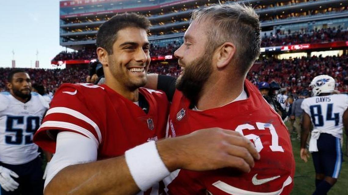 San Francisco 49ers quarterback Jimmy Garoppolo, center, hugs teammate Daniel Kilgore after a win over the Tennessee Titans in December.