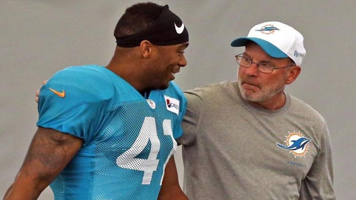 
Dolphins defensive coordinator Kevin Coyle, shown with safety Cedric Thompson during training camp, said he accepts the blames for the team’s poor defensive showing so far. 
