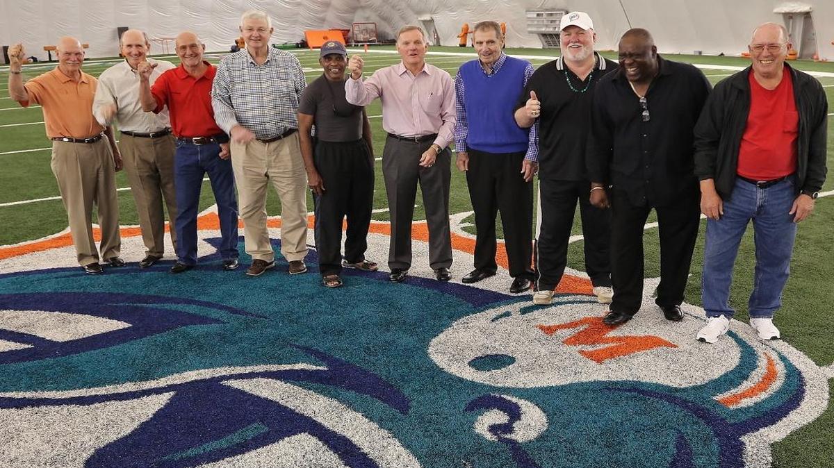 Guard Bob Kuechenberg, third from the left, poses with his teammates at the 40th reunion celebration of the 1972 Dolphins.