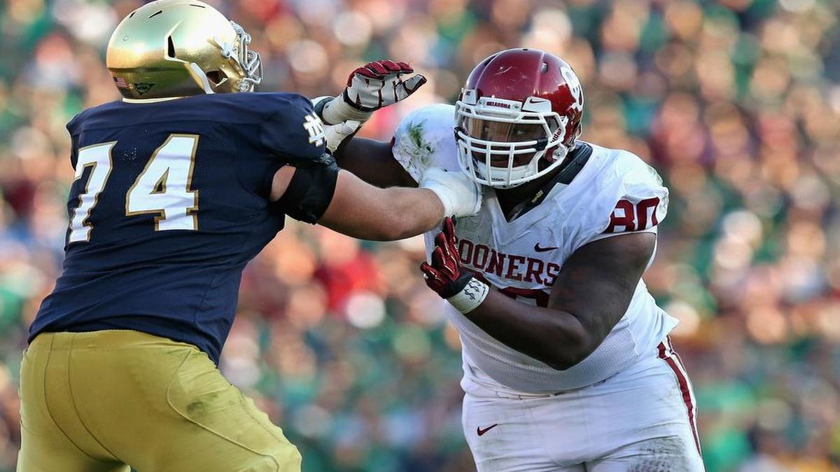 
Jordan Phillips #80 of the Oklahoma Sooners rushes against Christian Lombard #74 of Notre Dame at Notre Dame Stadium on Sept. 28, 2013 in South Bend, Indiana. 
