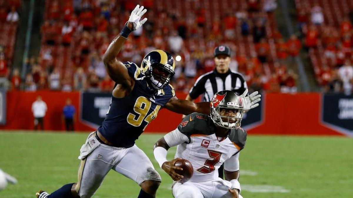 Tampa Bay Buccaneers quarterback Jameis Winston (3) is chased by Los Angeles Rams defensive end Robert Quinn (94) during a game Sept. 25, 2016.