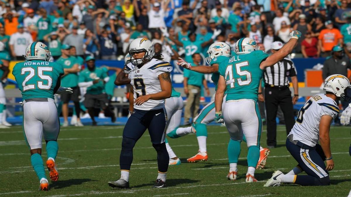 Los Angeles Chargers kicker Younghoe Koo (9) walks off the field after missing a field goal attempt in the final minute of the game during the second half of an NFL football game against the Miami Dolphins on Sept. 17, 2017, in Carson, Calif.