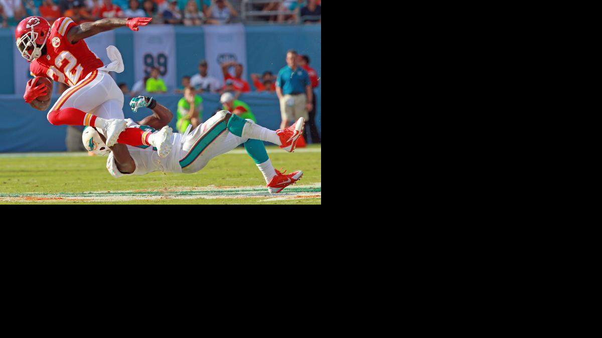 
Miami Dolphins linebacker Jelani Jenkins can't stop Kansas City Chiefs running back Joe McKnight in the second quarter at Sun Life Stadium in Miami Gardens, Fla., on Sunday, Sept. 21, 2014. 
