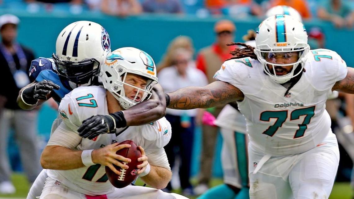 Miami Dolphins Billy Turner, 77, fails to stop Tennessee Titans Brian Orakpo from sacking Dolphins quarterback Ryan Tannehill in the fourth quarter at Hard Rock Stadium, in Miami Gardens on Sun., Oct. 9, 2016.