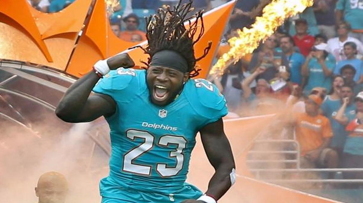 Miami Dolphins running back Jay Ajayi (23) rushes onto the field as the Miami Dolphins host the New England Patriots at Hard Rock Stadium on Sun., Jan. 1, 2017.