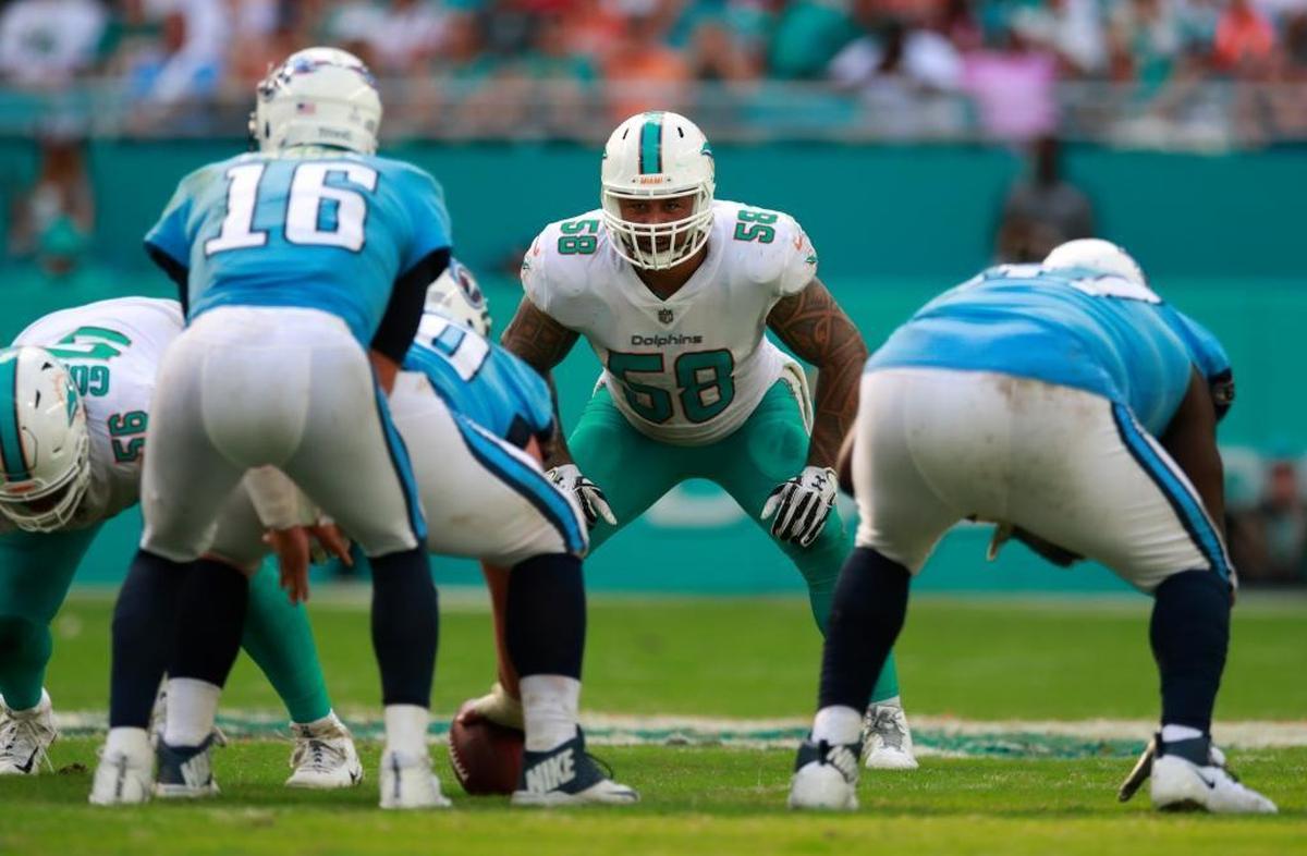 Two days before he was arrested and released by the Dolphins last week, linebacker Rey Maualuga, center, said he feared that he eventually will not be able to remember his daughter’s name and plans to donate his brain to charity.