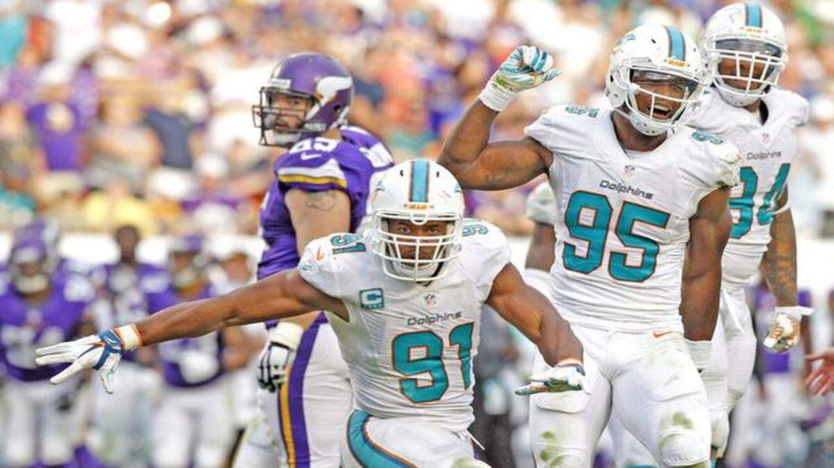 
Miami Dolphins defensive end Cameron Wake (91) reacts after sacking Minnesota Vikings quarterback Teddy Bridgewater (5) in the fourth quarter as the Miami Dolphins play host to the Minnesota Vikings at Sun Life Stadium on Sunday, Dec. 21, 2014.
