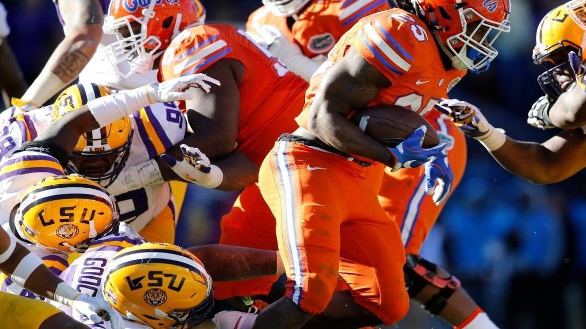 Davon Godchaux, shown on the ground, joins the Miami Dolphins’ defensive line.