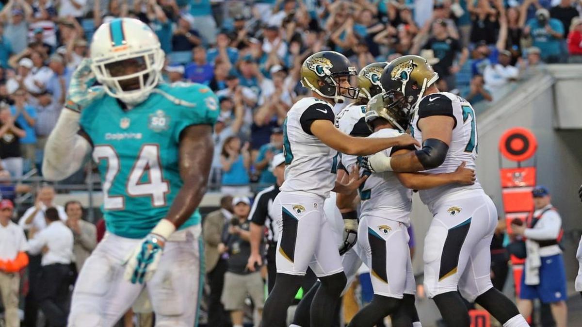 
Miami Dolphins Brice McCain 24, walks off the field after Jacksonville Jaguars kicker Jason Meyers kicked a field goal in the final second of the fourth quarter to beat the Dolphins 23-20, at EverBank Field in Jacksonville, Florida, September 20, 2015.
