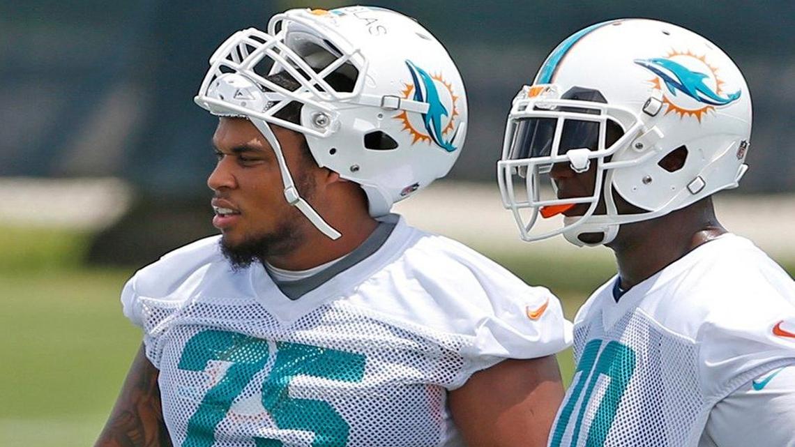 
The progress of rookie guard Jamil Douglas (75), shown with right tackle Ja'Wuan James, could determine whether the Dolphins sign free agent Evan Mathis. 
